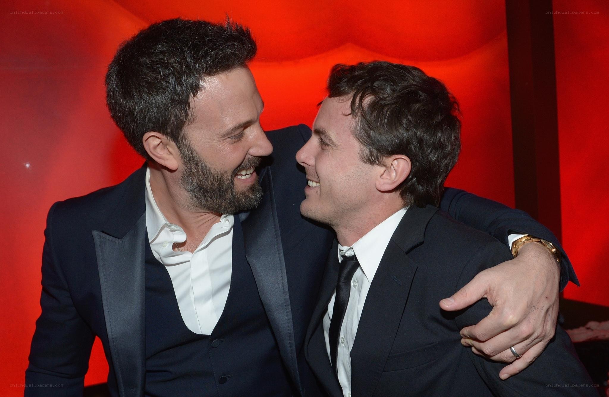 Two men laughing together