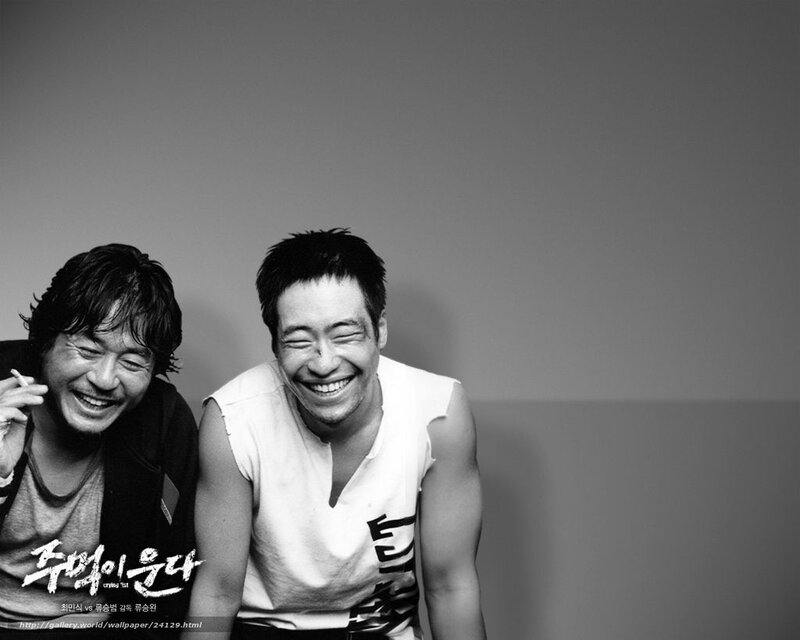 Two men laughing together