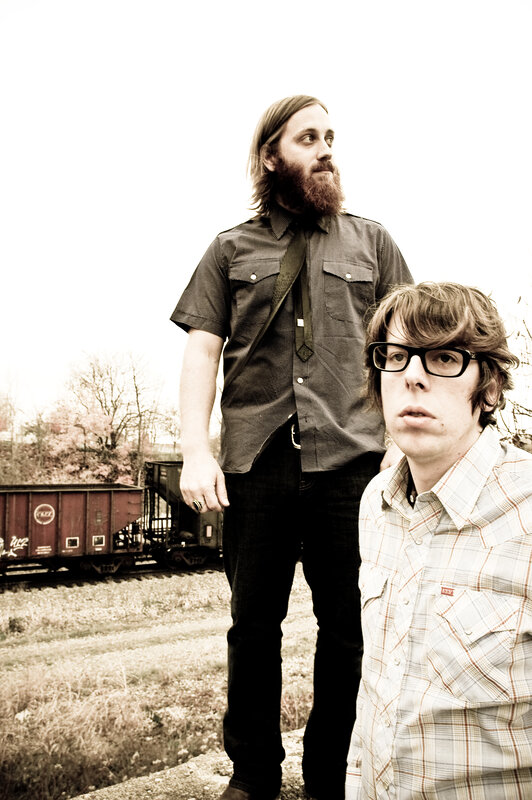 two men near train tracks