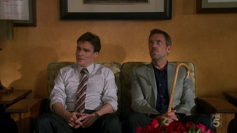two men on a couch