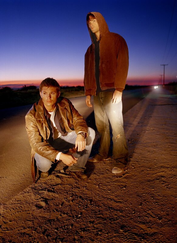 two men on a road at dusk