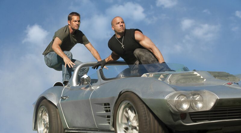 Two Men on Car Roof
