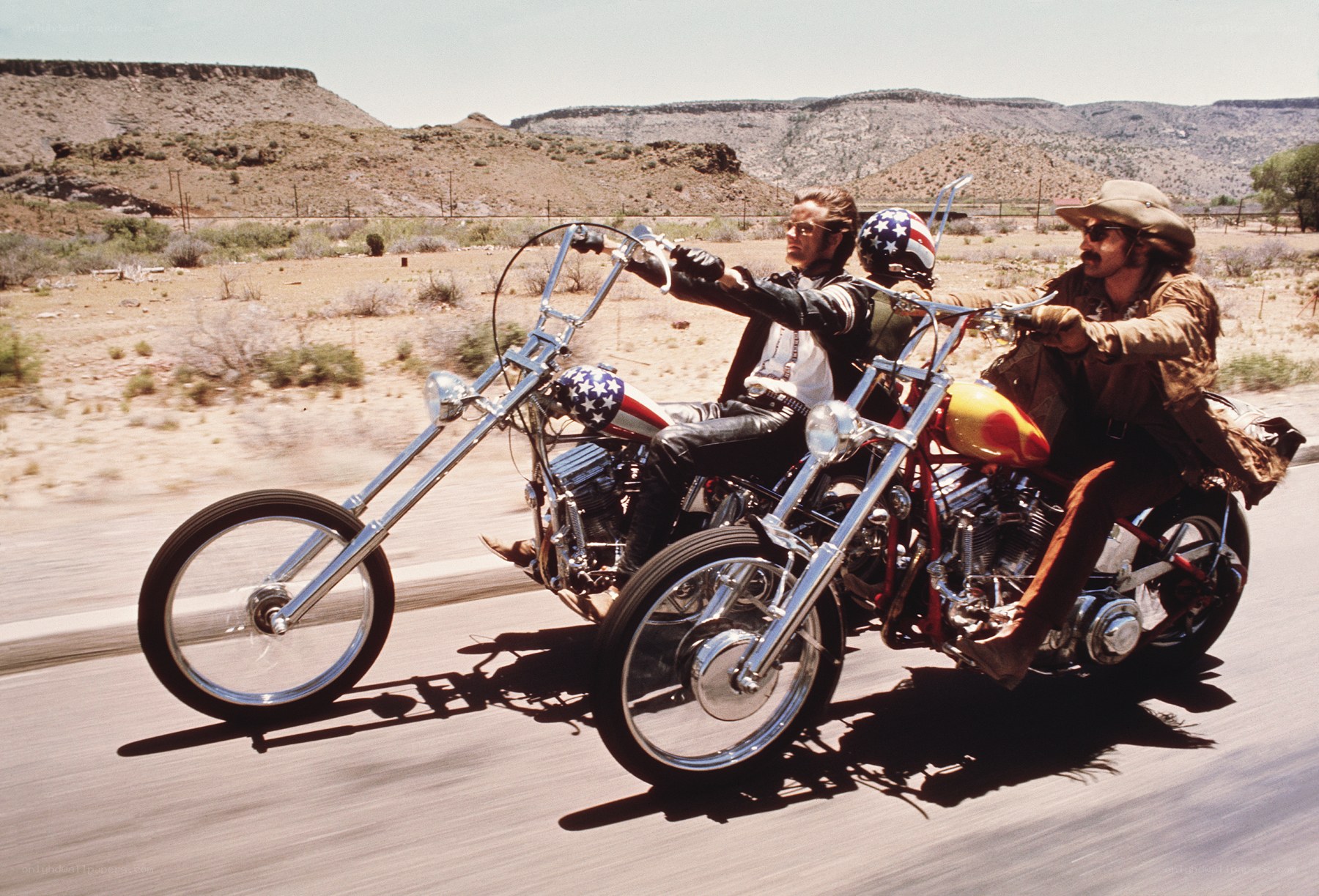 Two men on chopper motorcycles