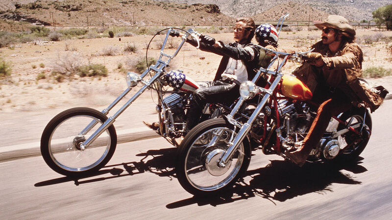 Two Men on Chopper Motorcycles — Brown, Driving