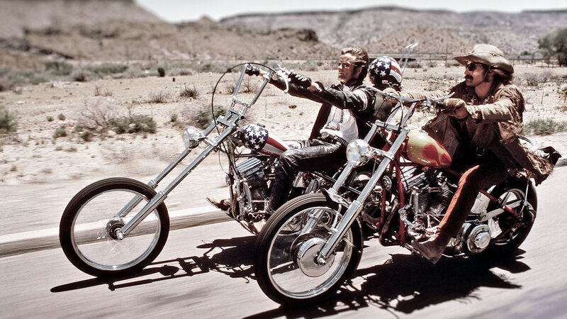 Two men on chopper motorcycles