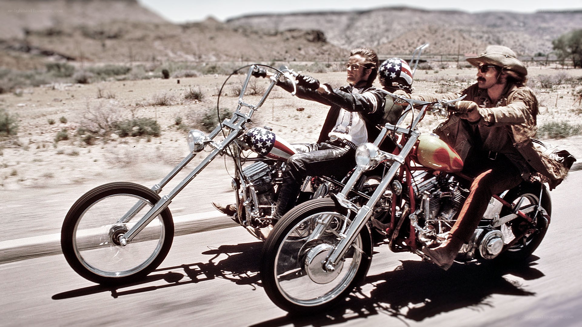 Two men on chopper motorcycles