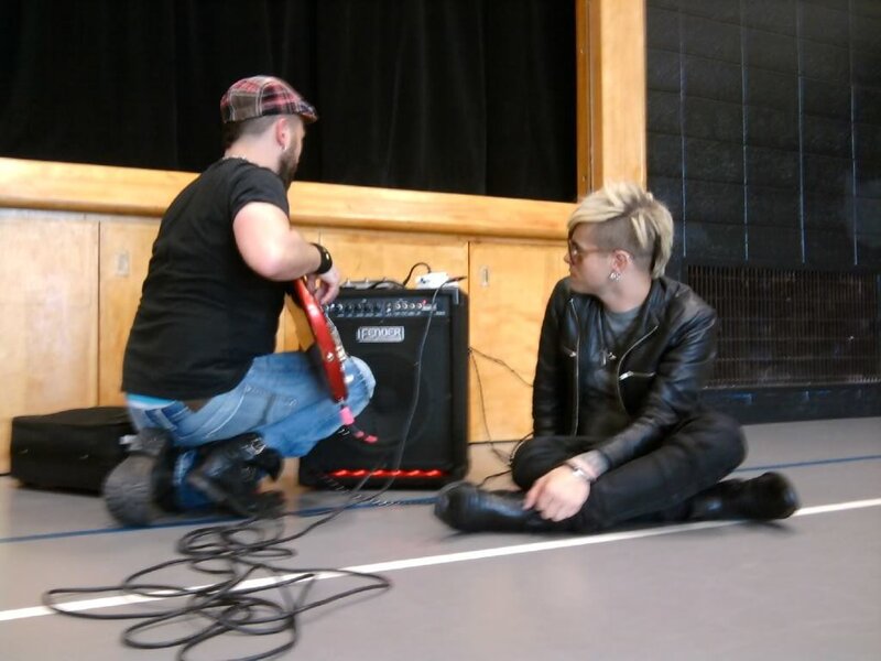 Two Men on Floor with Guitar