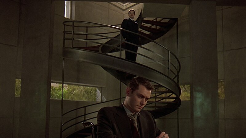 Two men on spiral staircase