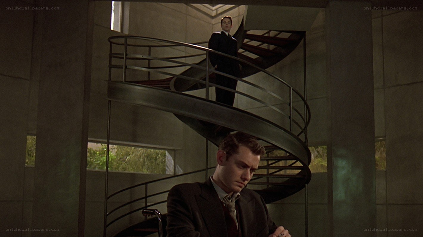Two men on spiral staircase