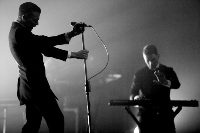 Two Men on Stage — Black
