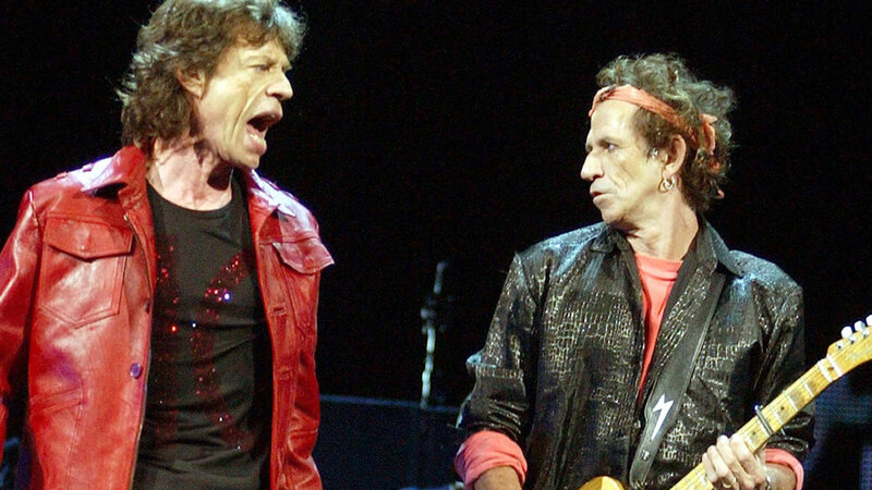 Two Men on Stage — Red