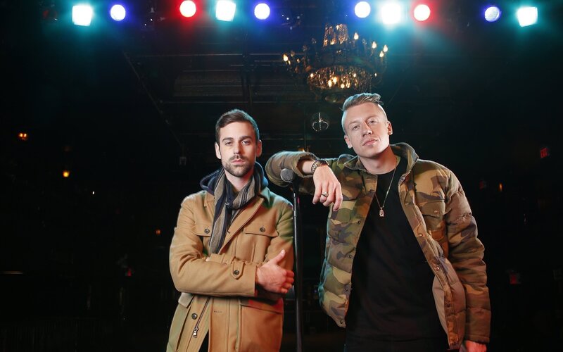 Two men on stage with lights