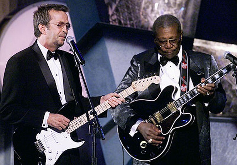 Two Men Playing Guitars