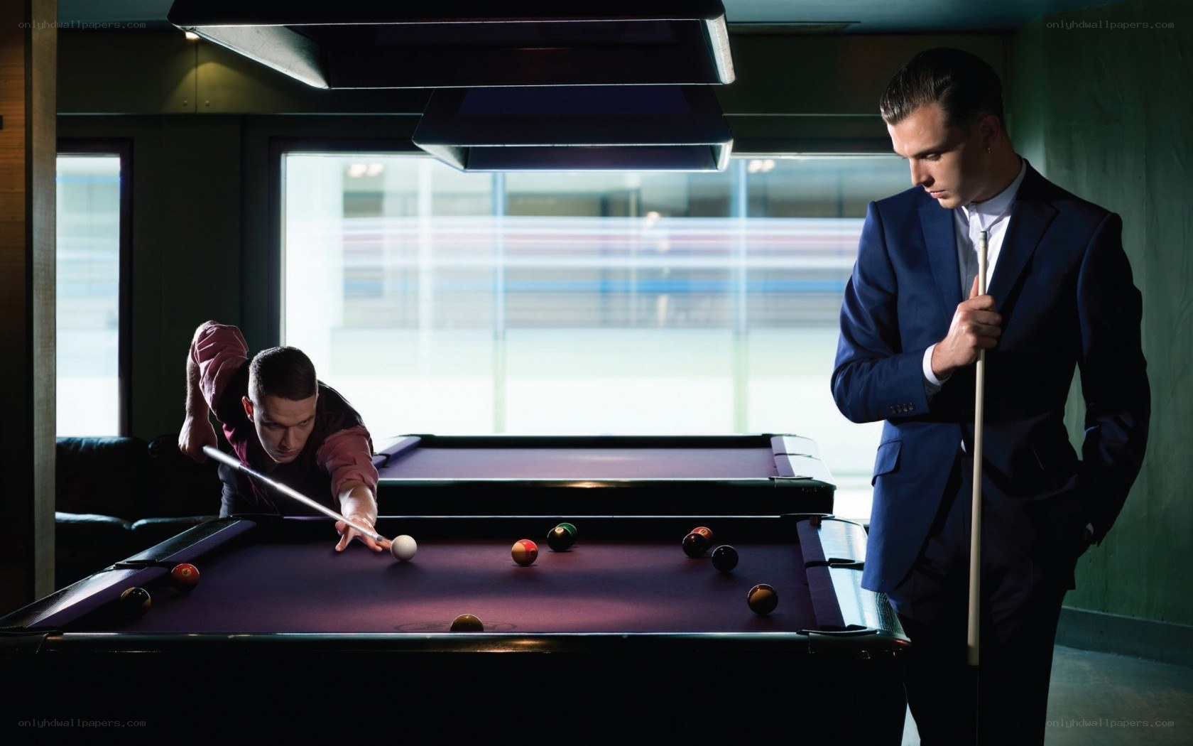 Two men playing pool