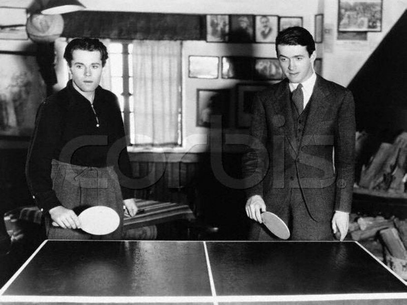 Two Men Playing Table Tennis