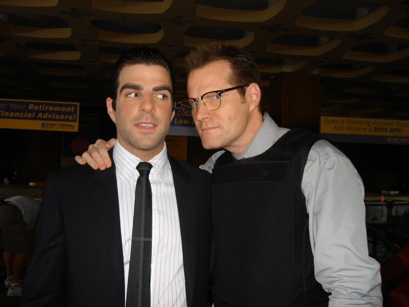 Two men posing at an event