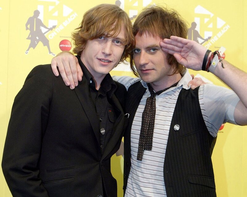 Two men posing at event