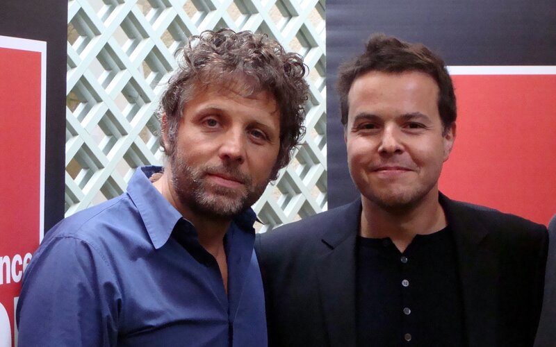 two men posing for a photo