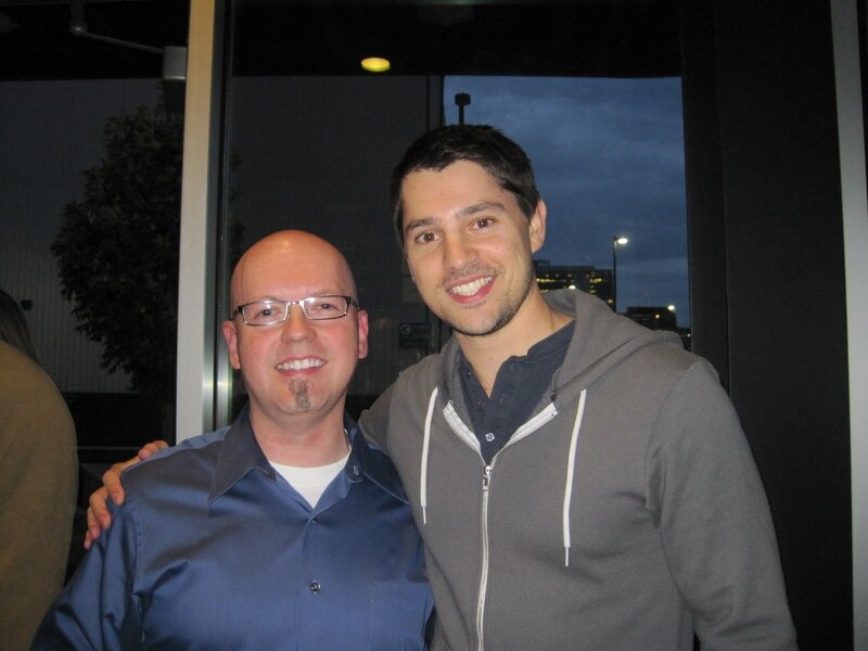 two men posing for photo