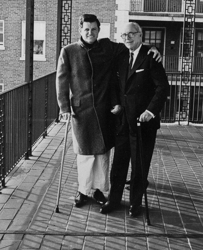 Two men posing on a walkway