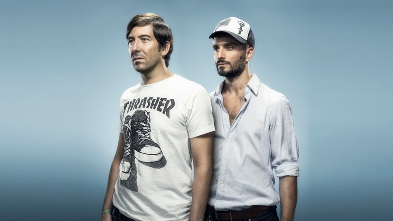 two men posing together