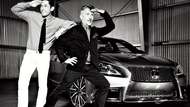 Two men posing with a Lexus