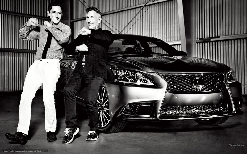 Two men posing with a Lexus