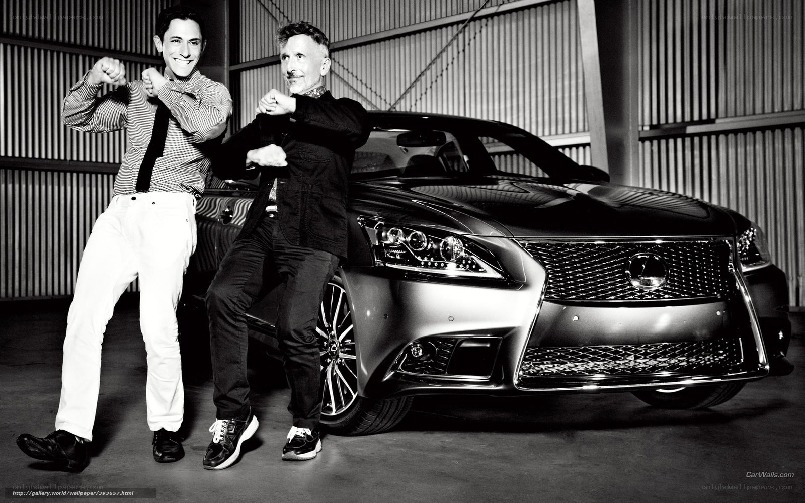 Two men posing with a Lexus
