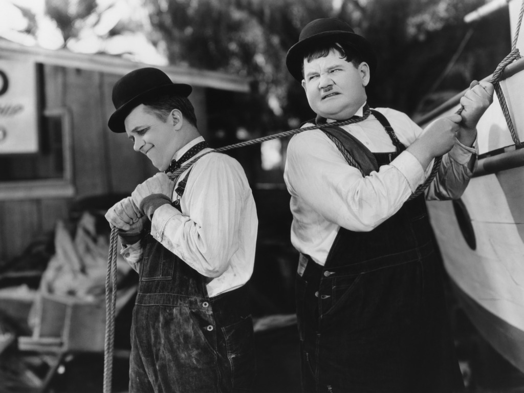 Two men pulling a rope