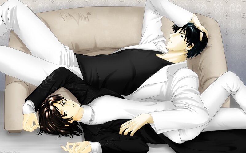 Two men relaxing on a couch
