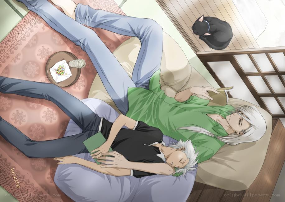 Two men relaxing on a futon
