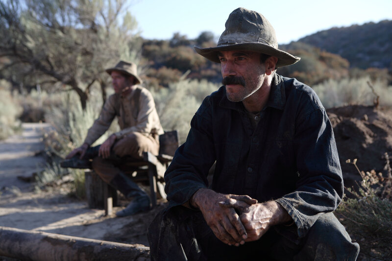 Two men resting in a desert