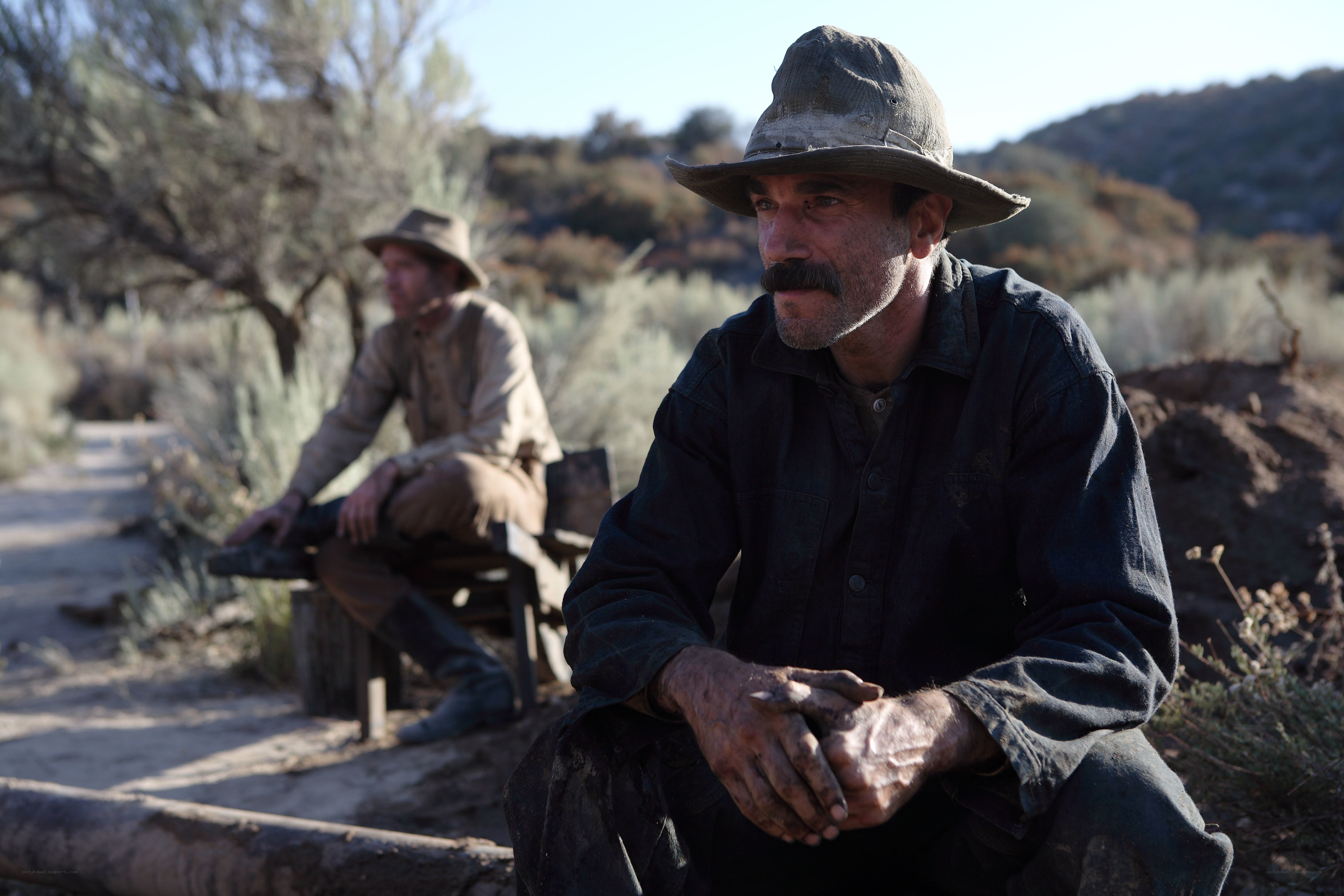 Two men resting in a desert