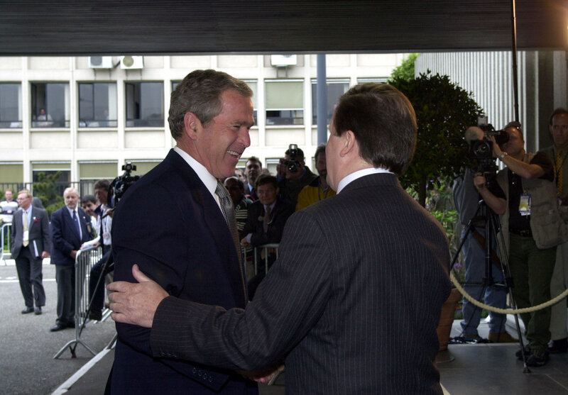 Two men shaking hands at event