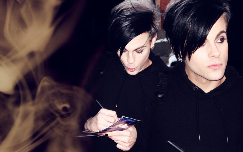 Two Men Signing Autographs