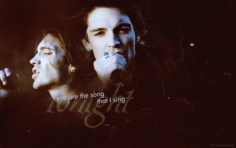 Two Men Singing on Stage