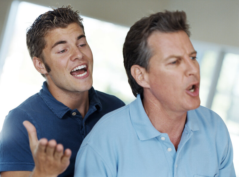 Two men singing together