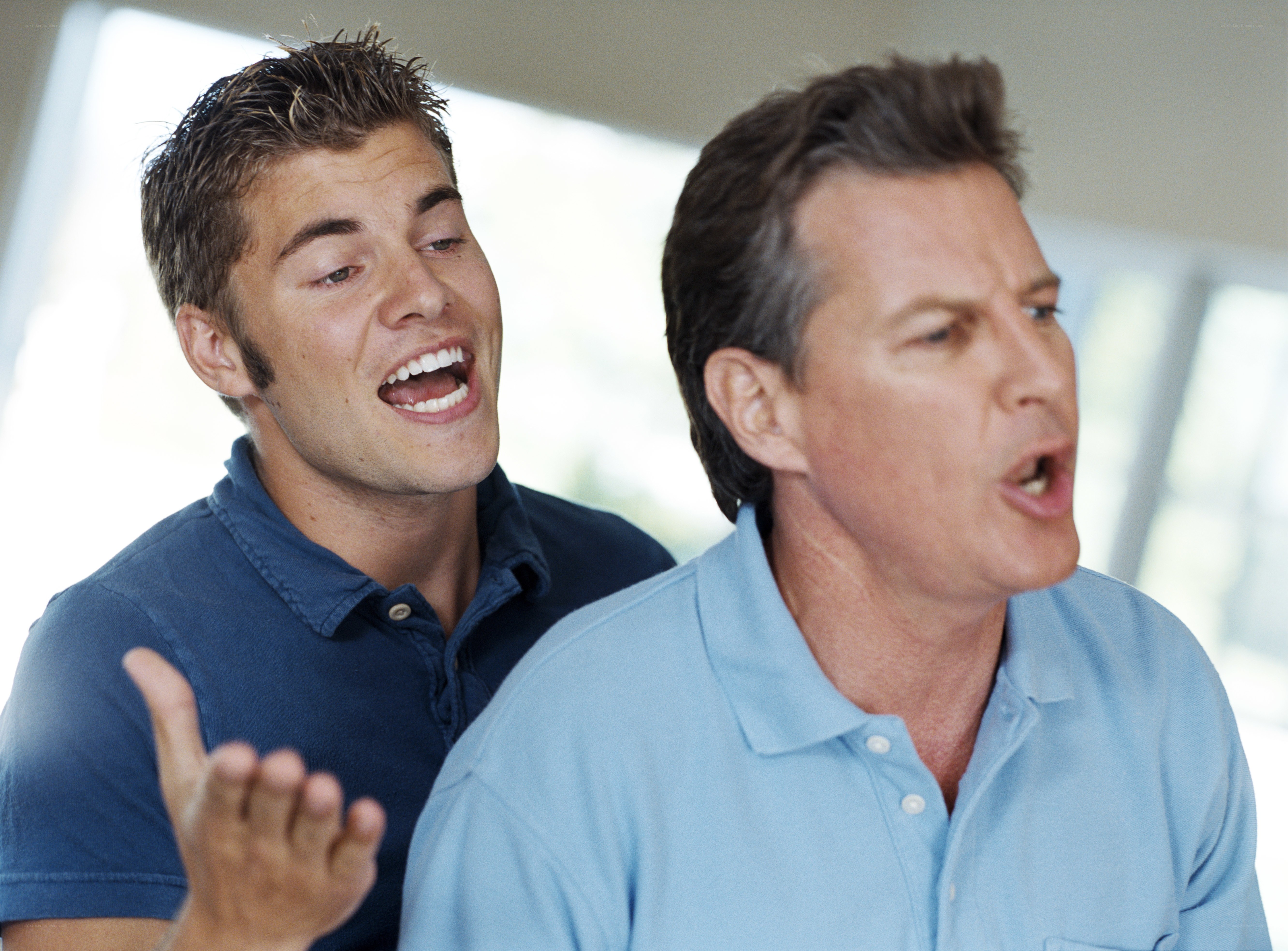 Two men singing together