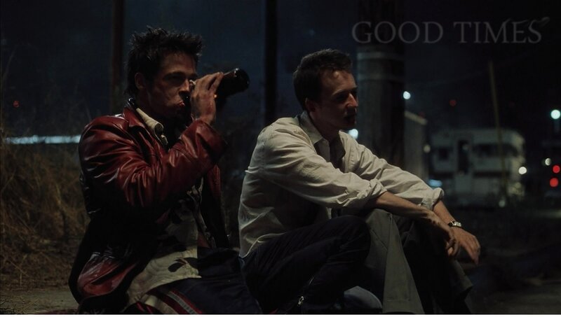 Two men sitting at night