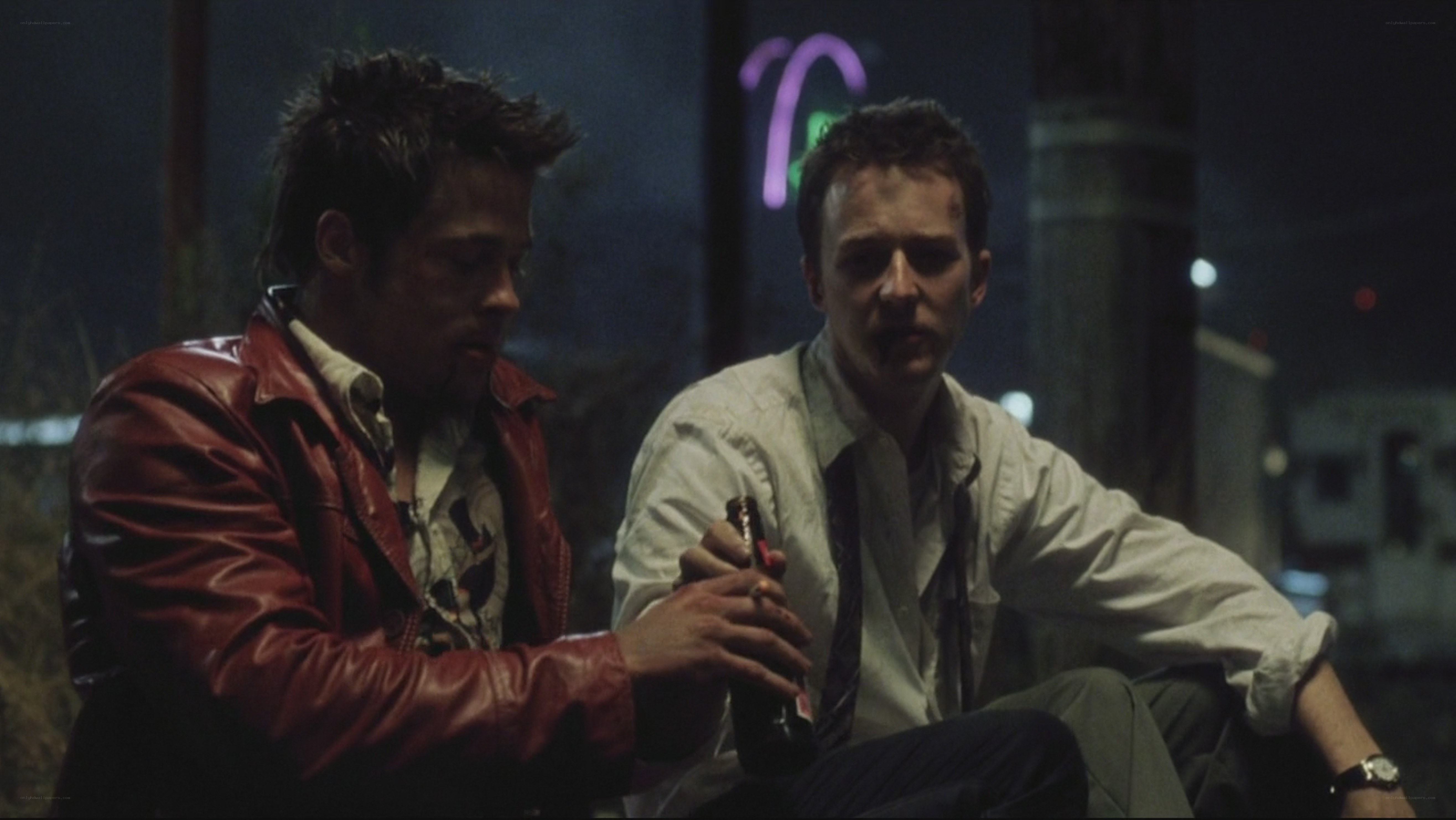 two men sitting at night