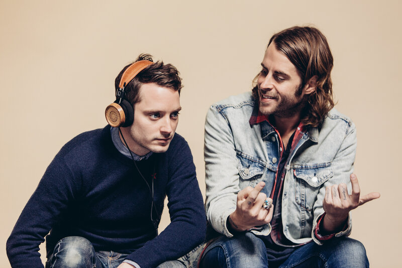 Two Men Sitting — Beige