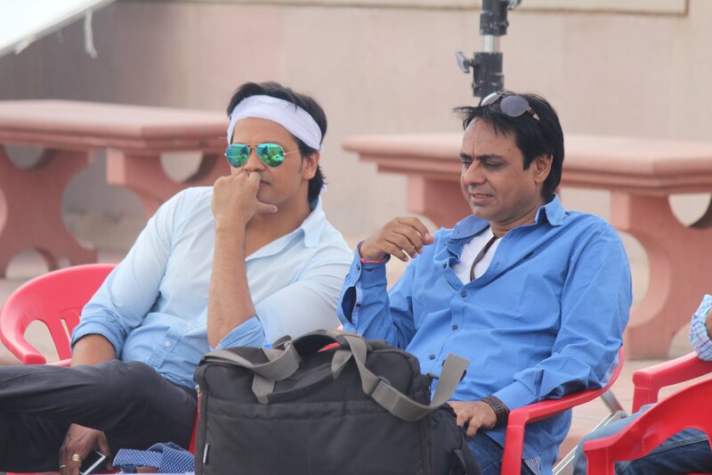 Two Men Sitting — Blue, Relaxed, Afternoon