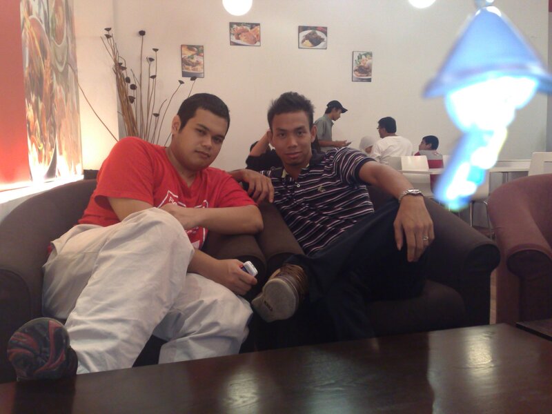 Two men sitting on a couch