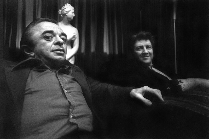 Two Men Sitting on a Couch — Black, Dramatic