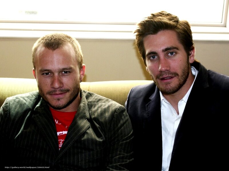 two men sitting on a couch