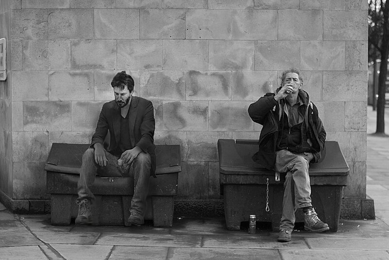 Two Men Sitting on Benches — Black