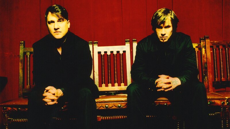 two men sitting on chairs