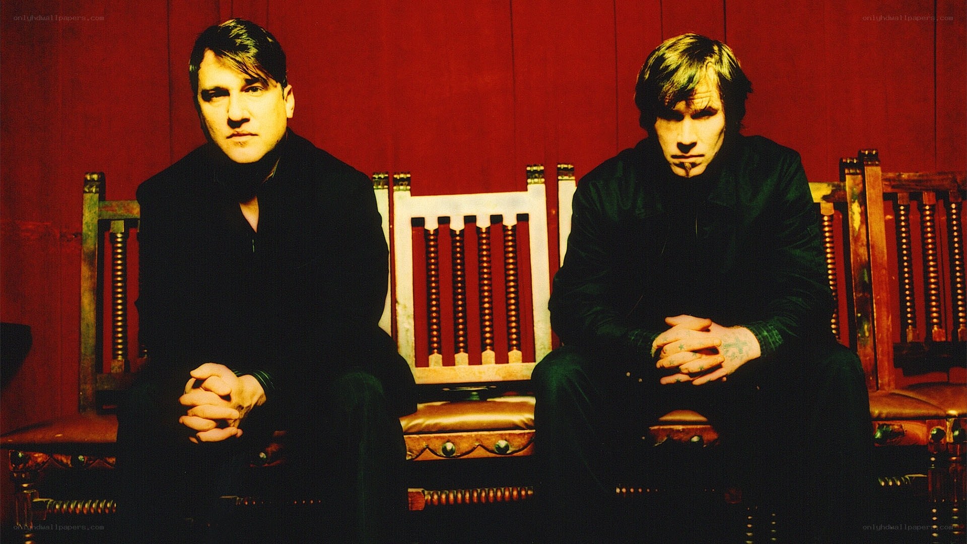 two men sitting on chairs
