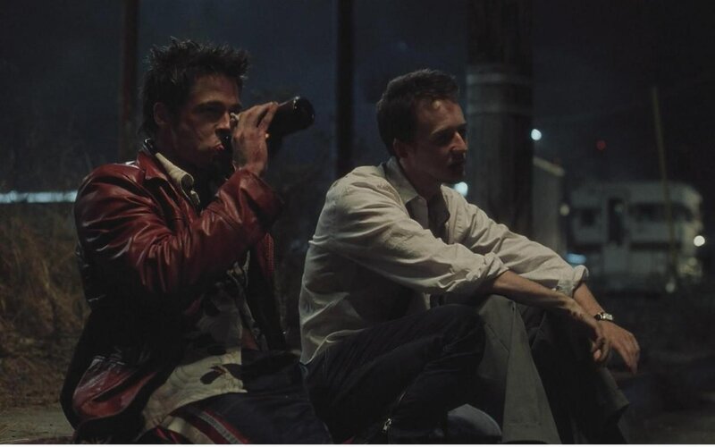 Two Men Sitting on Ground — Black, Dramatic