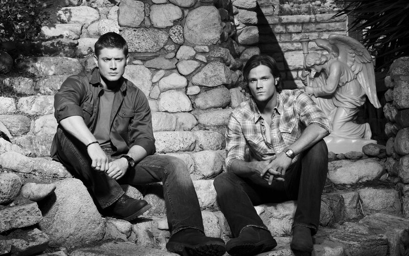 two men sitting on stone steps